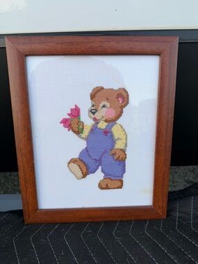 Framed Cross-Stitch Teddy in Blue Overalls with Pink Flowers